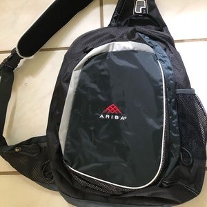 Black crossbody computer bag.Embroidered w/ Ariba